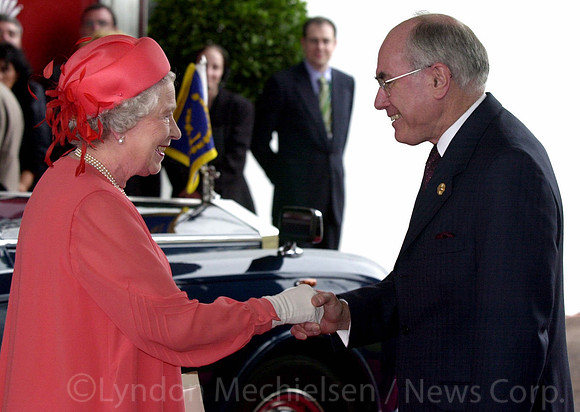 2/3/2002 -  The Queen shakes hands with pm John Howard arrives  for the opening ceremony of the CHOGM meeting at Hyatt Coolum on the Sunshine Coast of Coolum. Royal visits. Tour of Australia